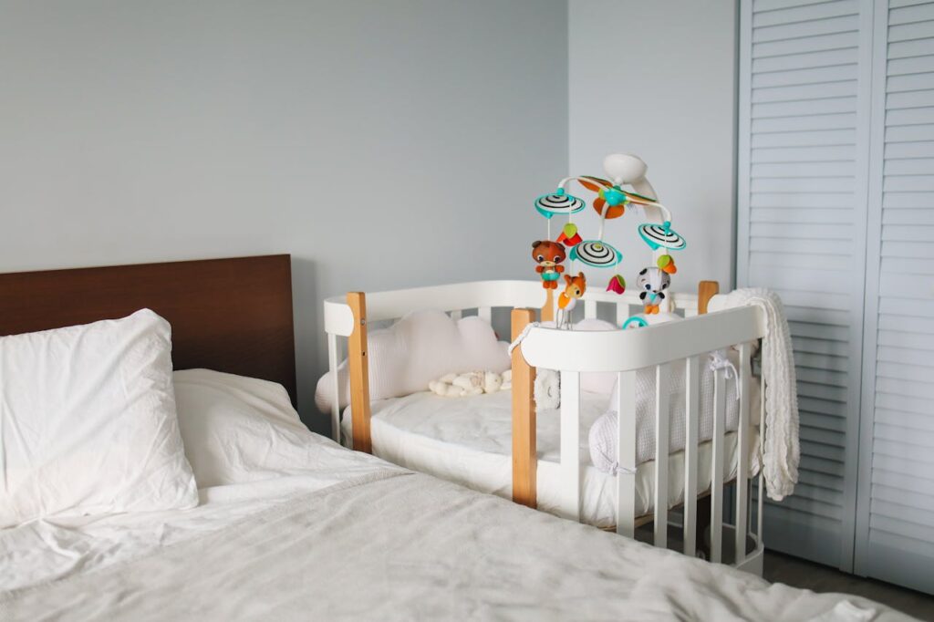 crib next to bed