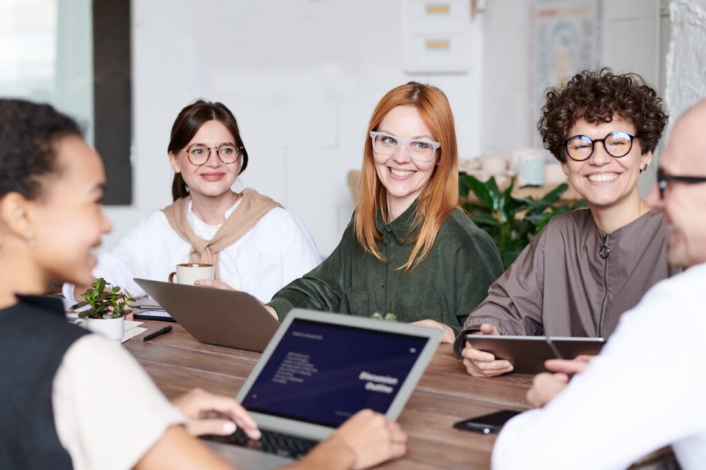 group of people sitting and smiling