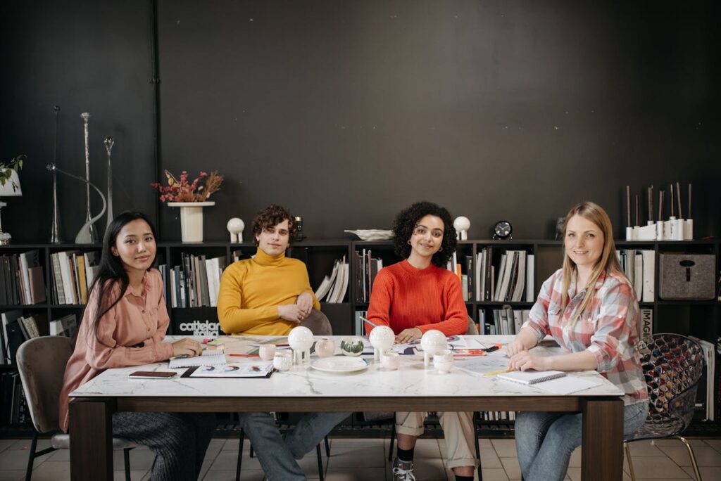 People Sitting and Smiling at the Camera