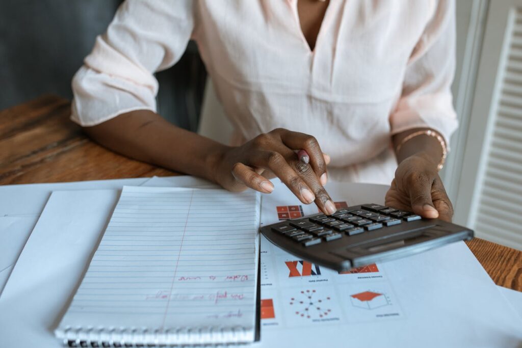 woman calculating costs of moving to one of the most expensive cities in the US