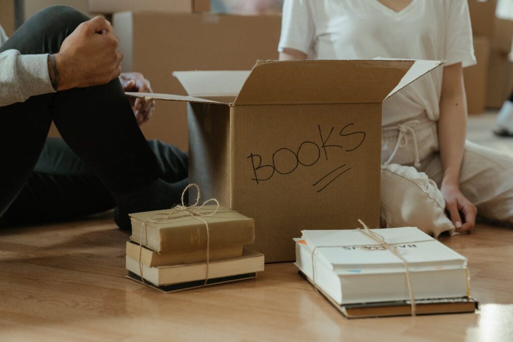 Brown Cardboard Box on Brown Wooden Table
