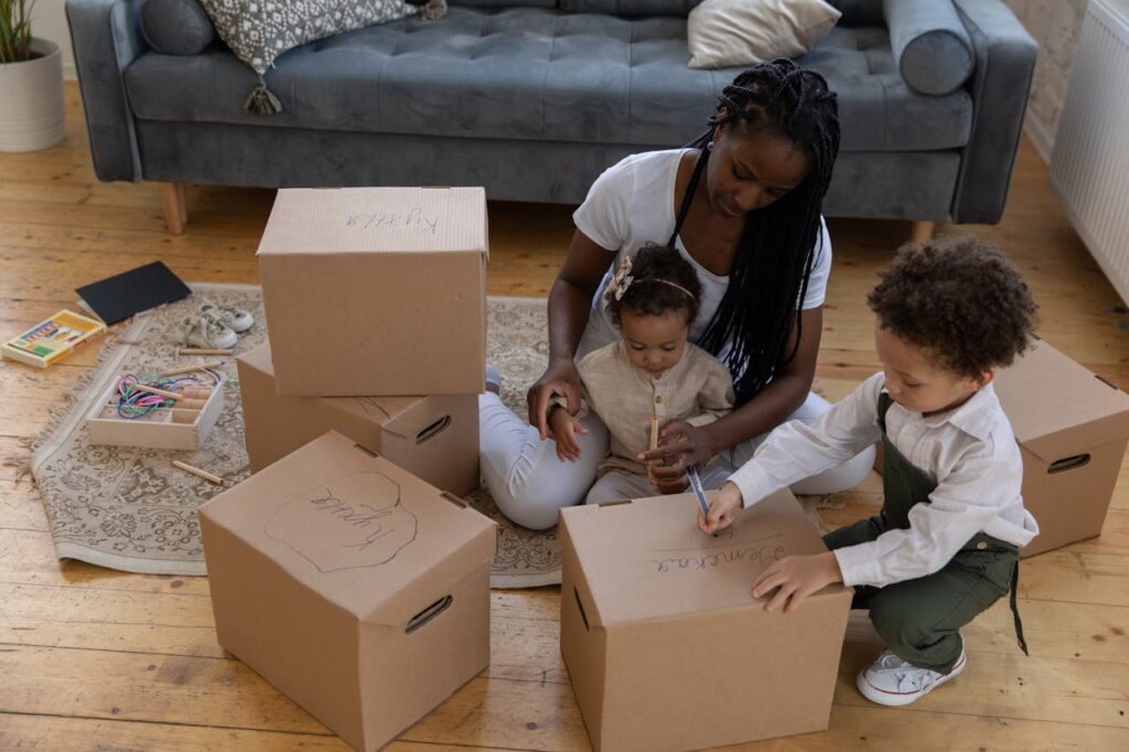 mother and children packing boxes
