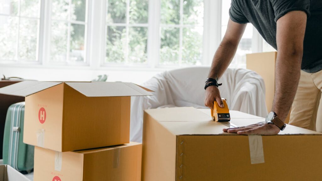 man packing boxes