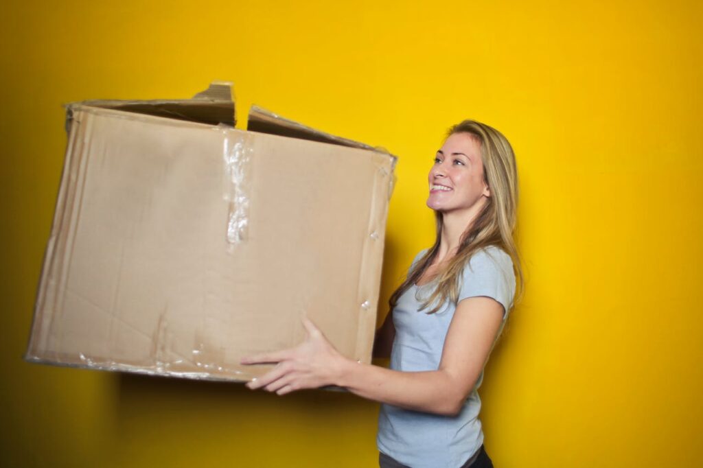 woman holding big box