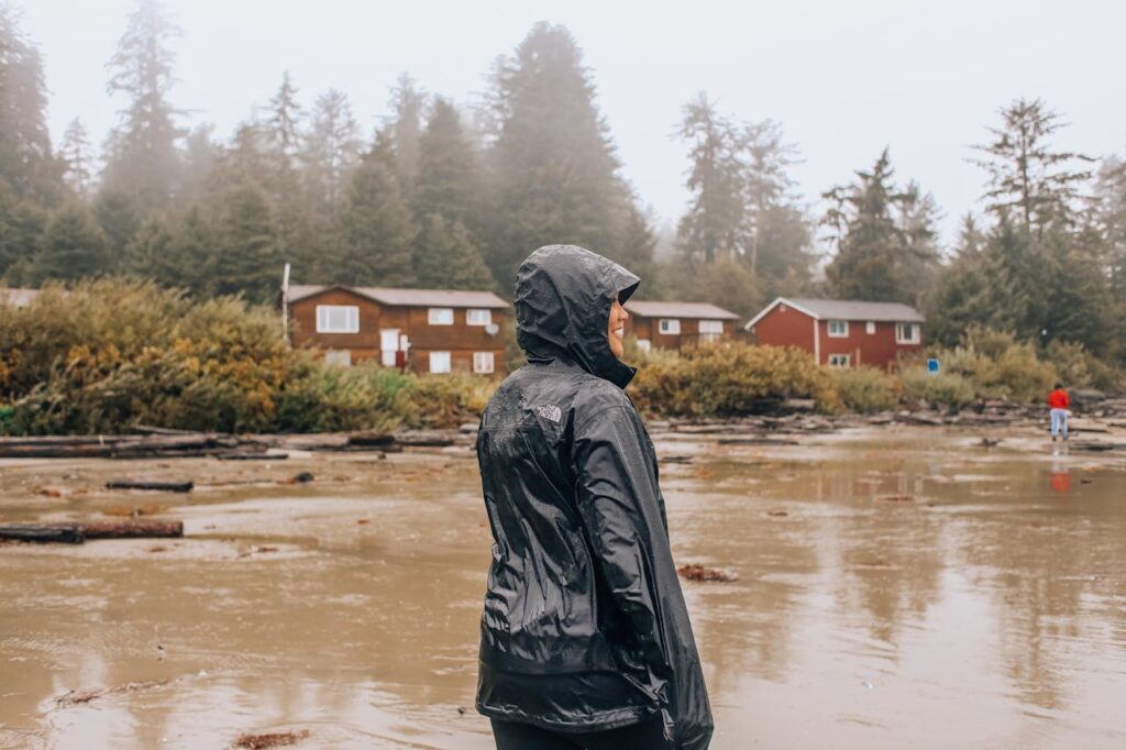 woman standing near houses