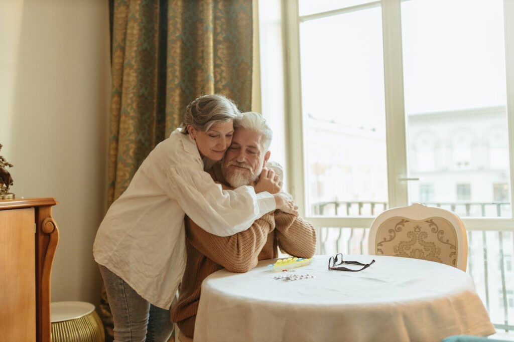 man and woman hugging