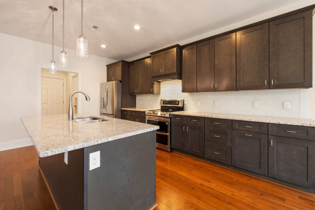 Black Wooden Kitchen Cabinet and White Wall
