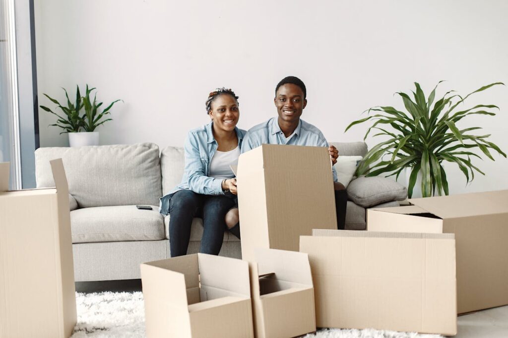 couple holding boxes for moving from Atlanta to San Antonio