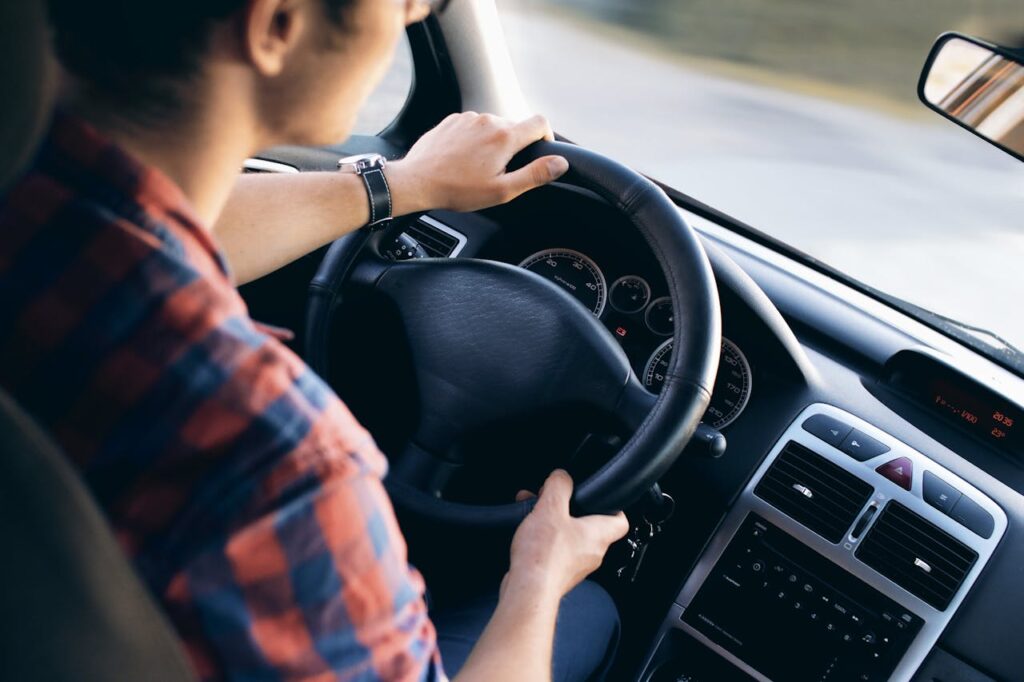 man driving a vehicle