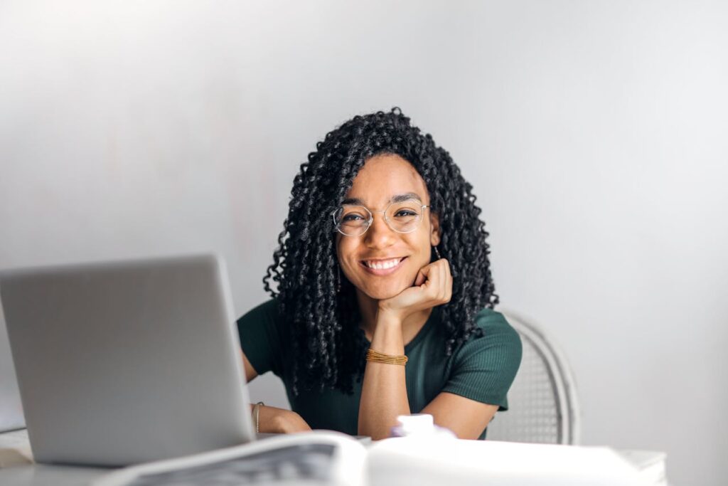 woman with glasses smiling