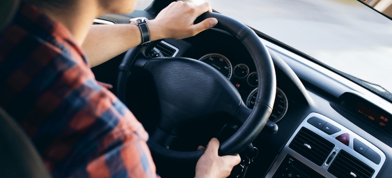 a man drives a car