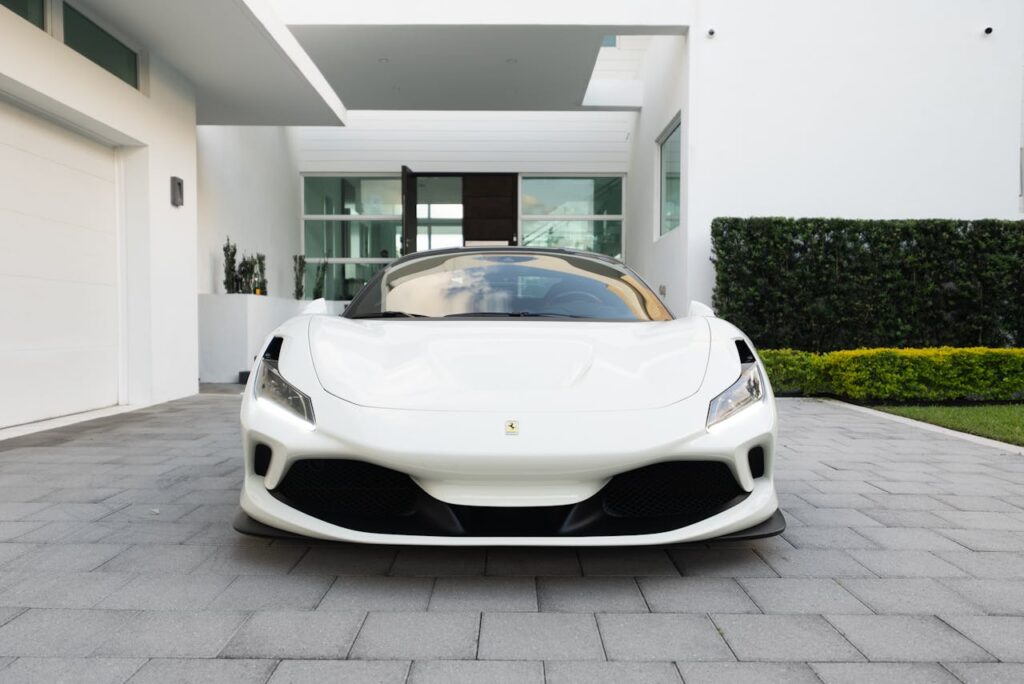 Sports Car Parked on Concrete Pavement
