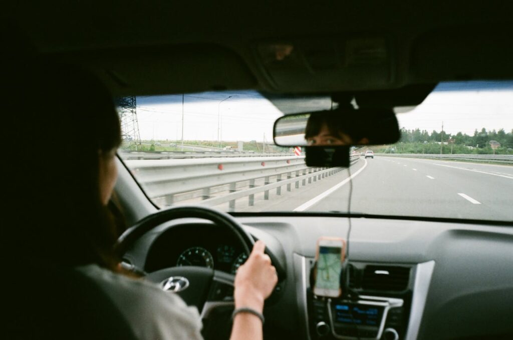 Woman driving and thinking about shipping a car from Illinois to Texas
