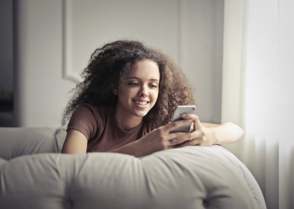 woman looking at her phone