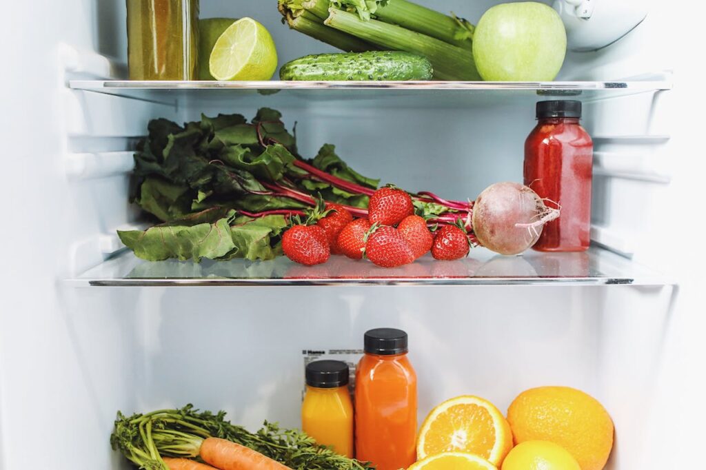 Assorted Fruits and Vegetables in Refrigerator

