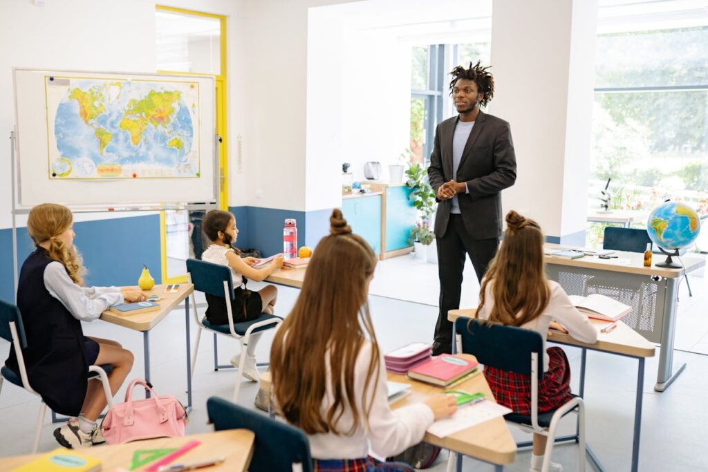 Man in Suit Teaching in Elementary School
