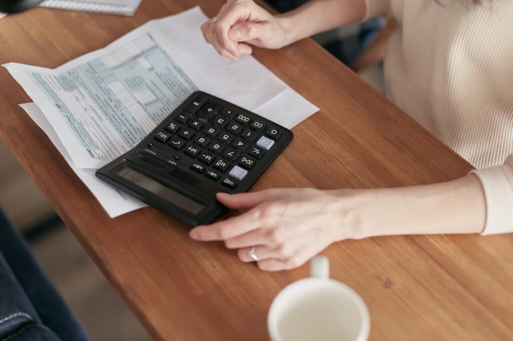 person calculating costs