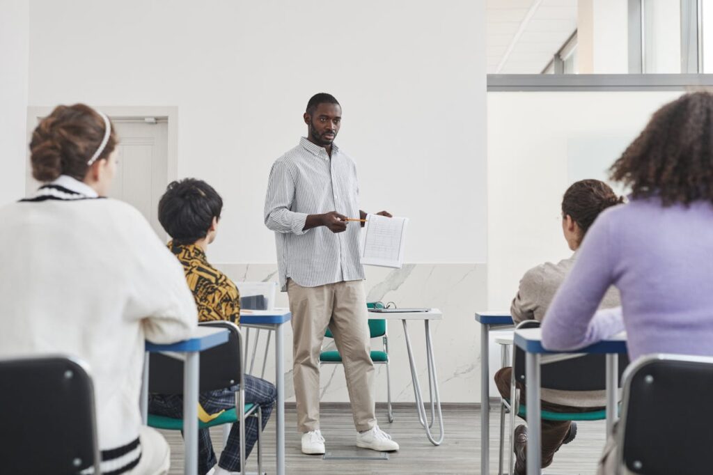 A Man Showing a Paper to His Students