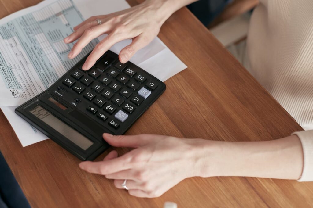 woman using calculator