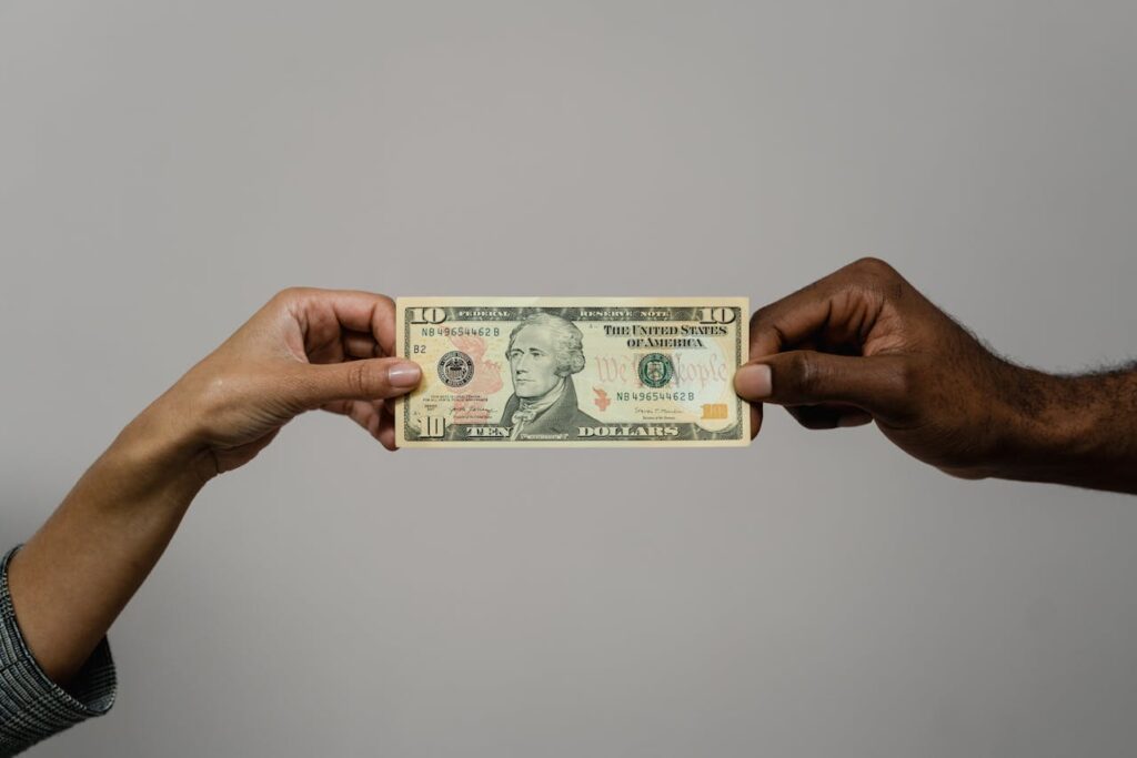 hands holding a paper bill